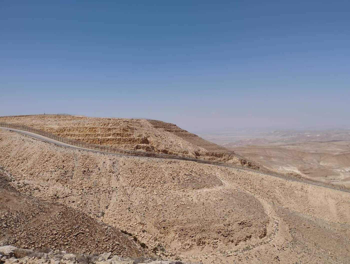 A winding road through a rocky desert landscape