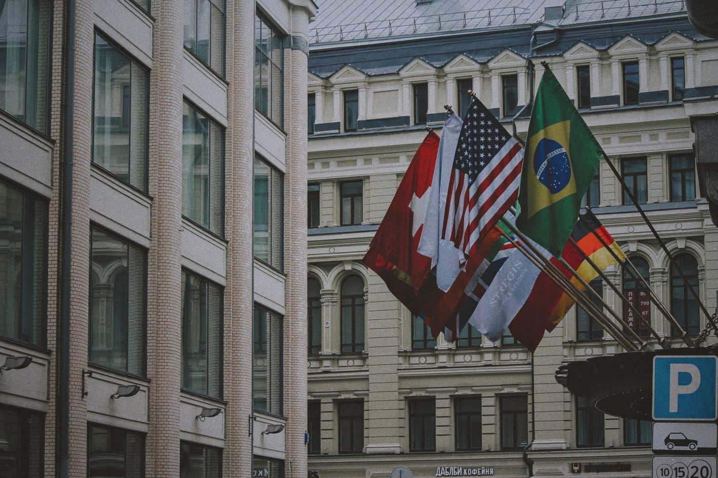 International flags displayed outside an urban building in daylight