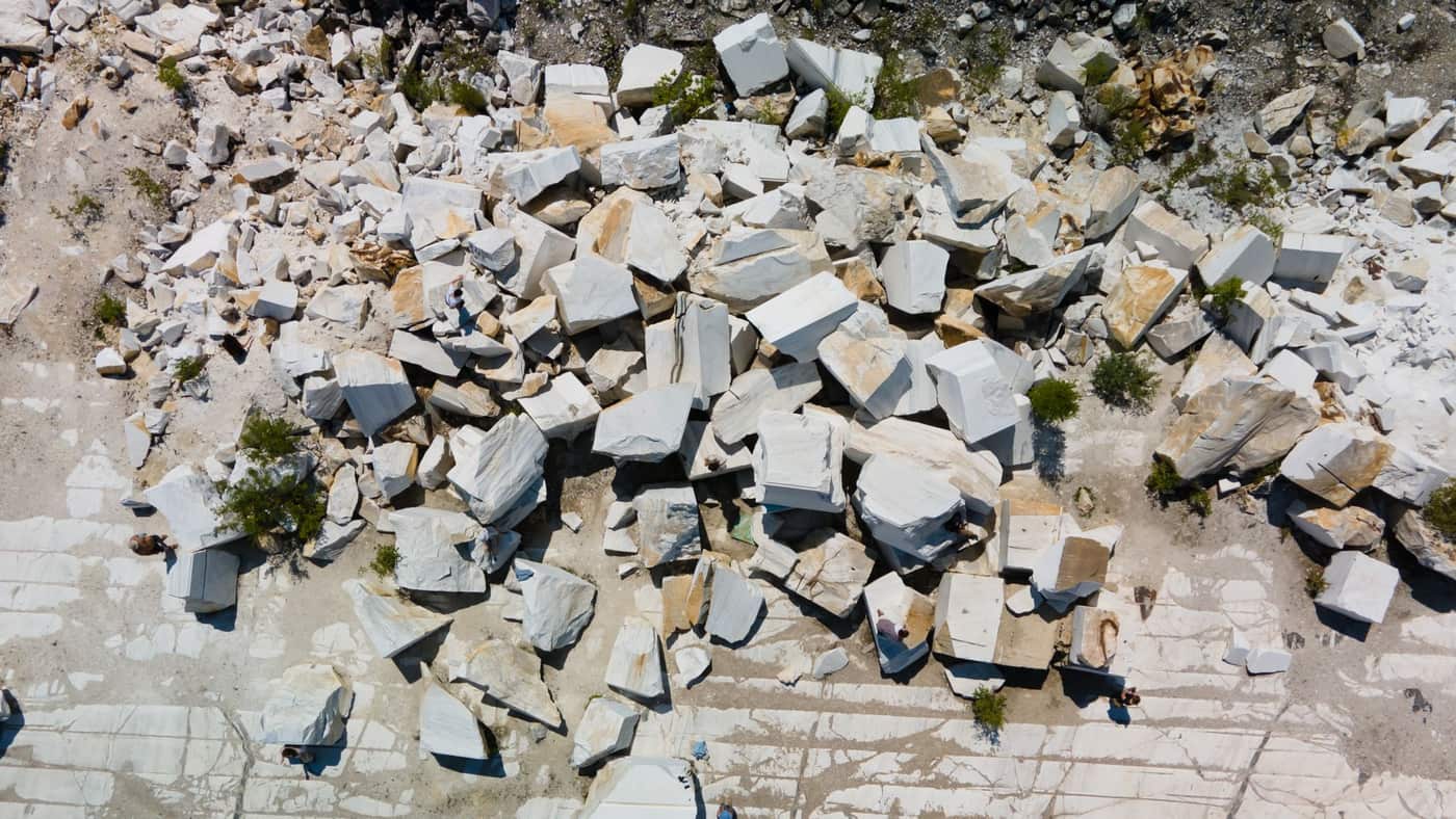High-angle view of a marble quarry with large cut stone blocks