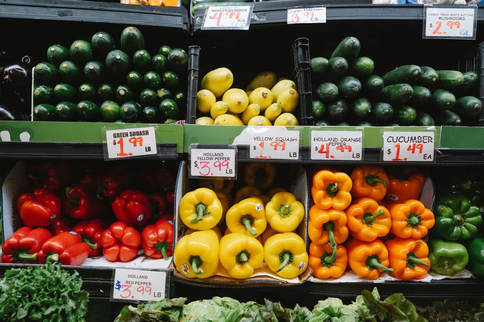 Colorful assortment of fresh vegetables and produce on display at a supermarket