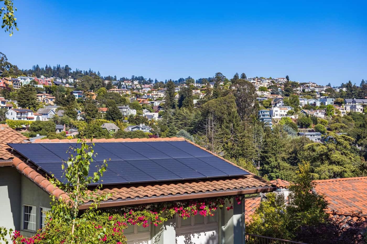 Solar panels installed on the roof of a suburban home